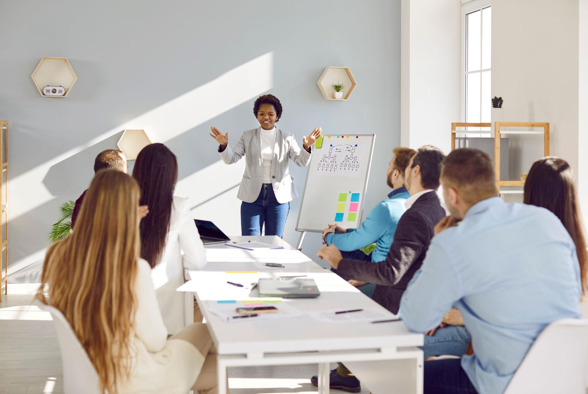 Communications leader presenting to a team